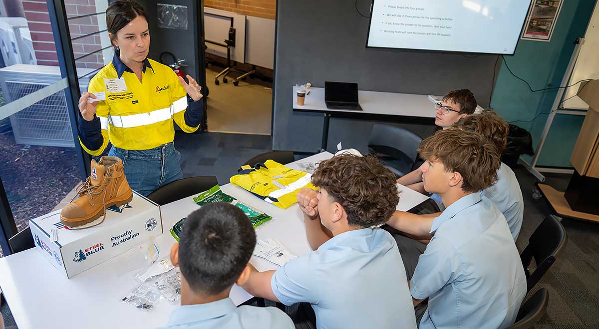 Jessica Wilcox, ACCIONA, showing Penola Catholic College Students the proper work attire